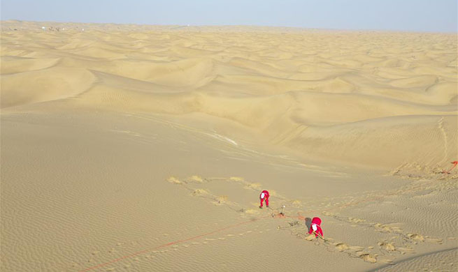 Oil exploration workers engaged in hard work in Taklimakan Desert, Xinjiang